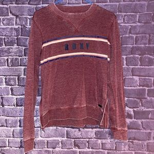 Roxy brand maroon sweatshirt in a size medium.